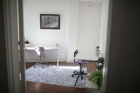Seeking 1or 2 vibrant office mates in shared workspace - large desk