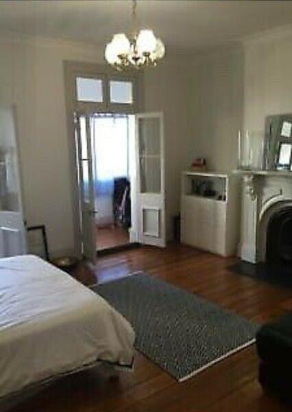 Surry Hills queen sized Furnished room with a sunroom
