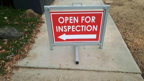 Signs frames open for inspection